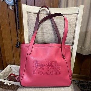 New coach tote leather pink with horse and carriage on front.